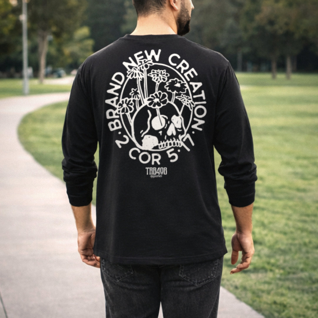 Black long sleeve Brand New Creation Tee, Back Male model walking on sidewalk, Christian Apparel